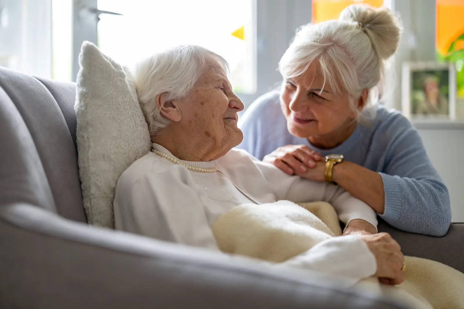 Daughter caring for her elderly mother at home