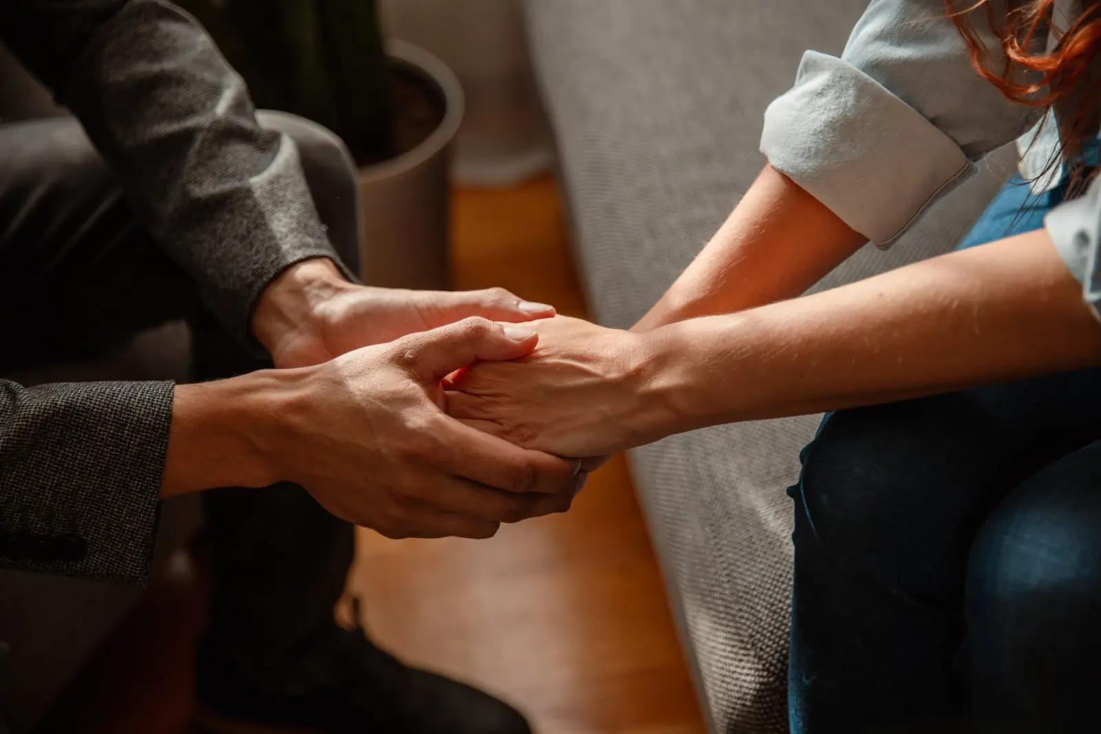 Family member holding hands in support