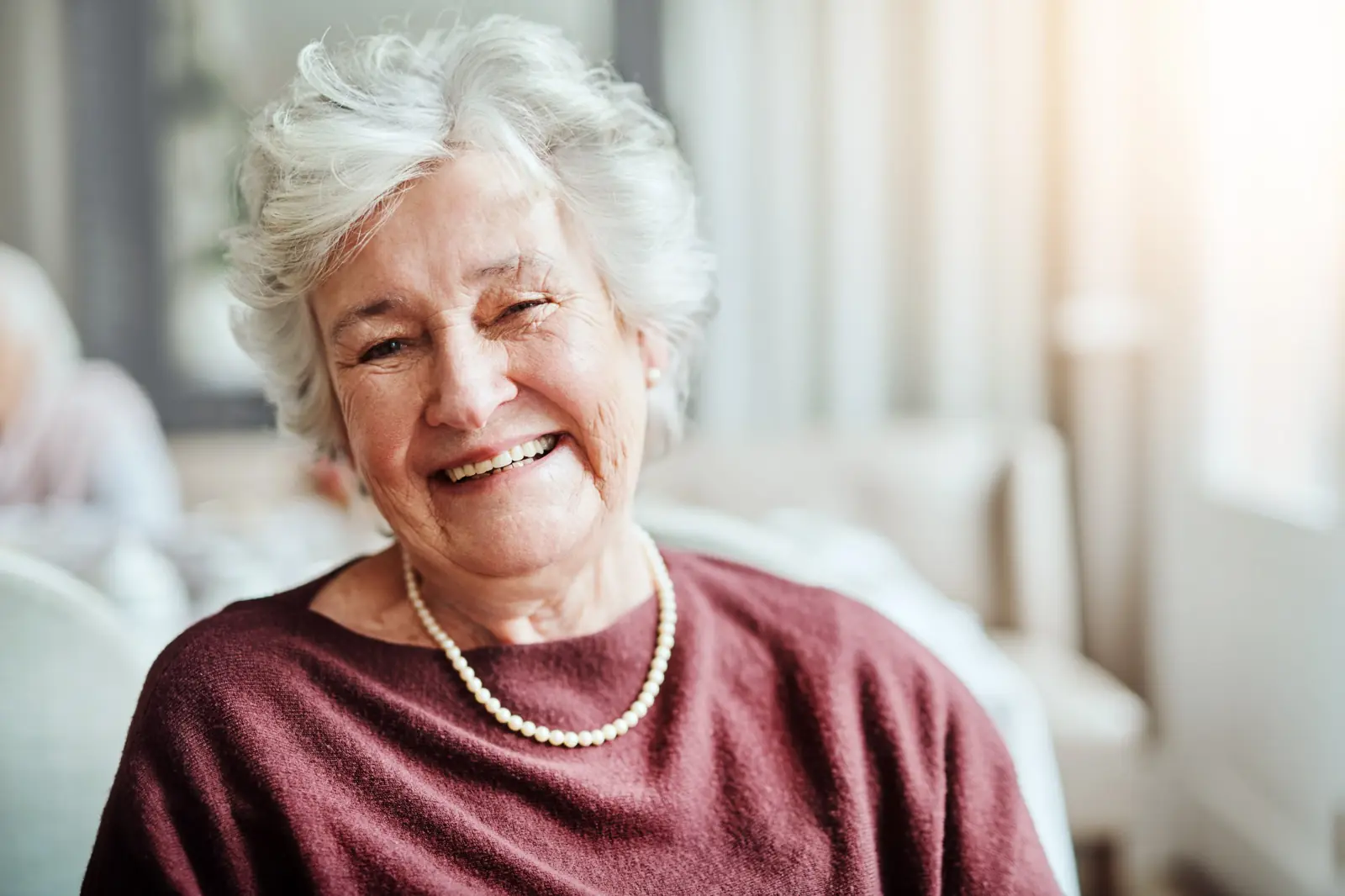 Smiling senior woman at home